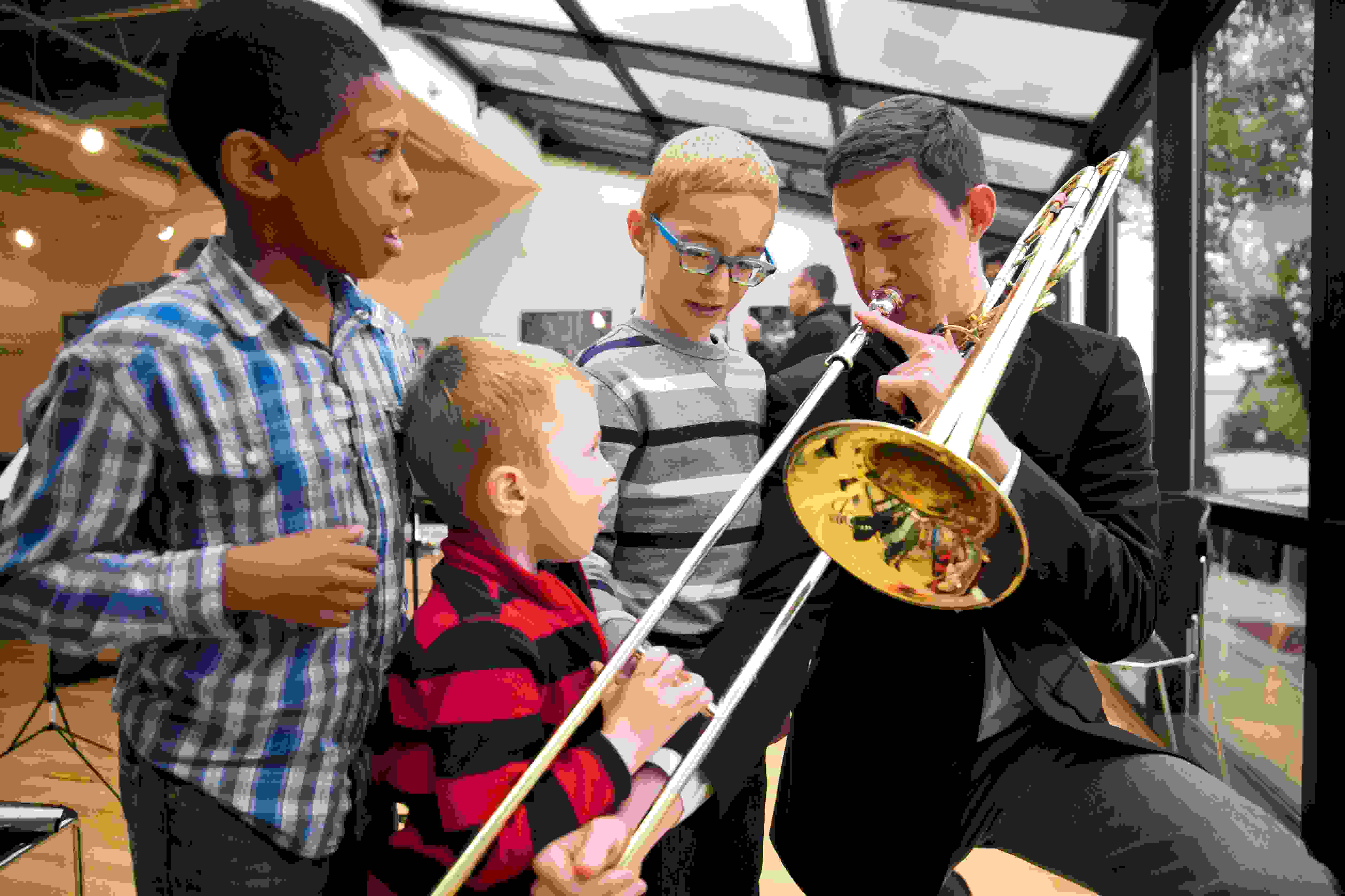 Civic Fellow trombone with kids