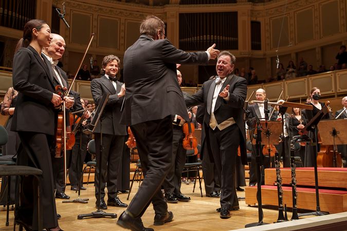 composer Christopher Theofanidis and CSO Principal Clarinet Stephen Williamson embrace after the world premiere performance of Indigo Heaven