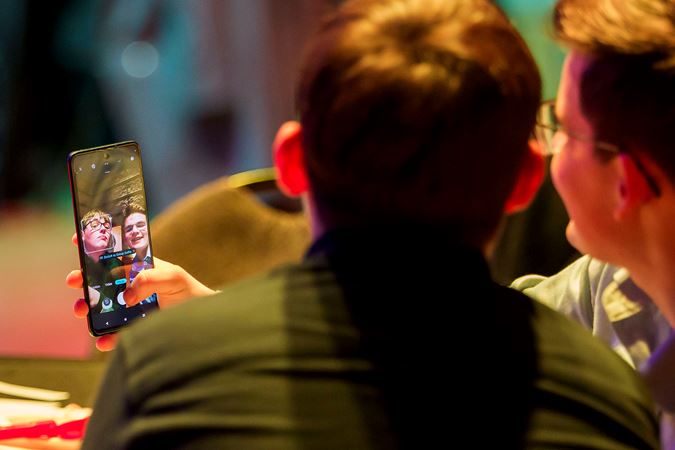 two students take a selfie at College Night