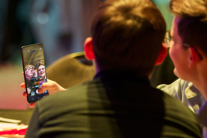 two students take a selfie at College Night