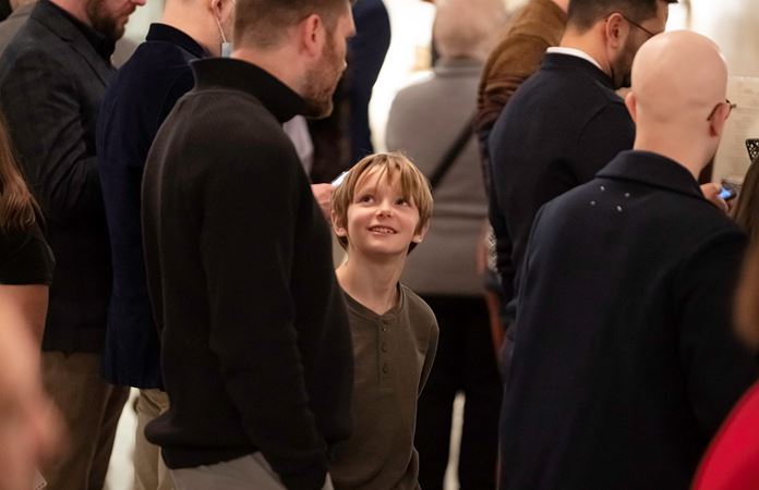 A young audience member and his guardian standing in the Main Floor lobby