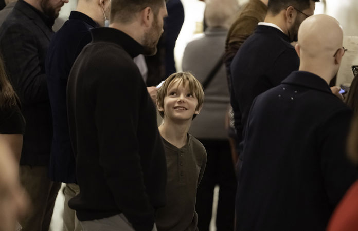 A young audience member and his guardian standing in the Main Floor lobby