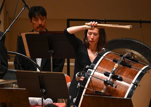 percussionist playing bass drum