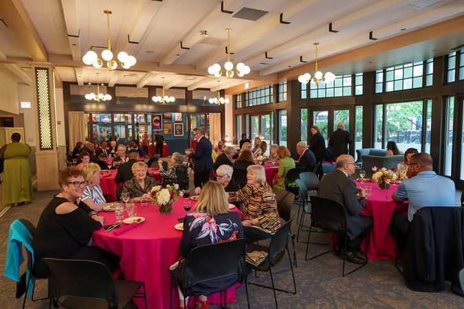 A wide shot of the Drinks/Bites benefit event