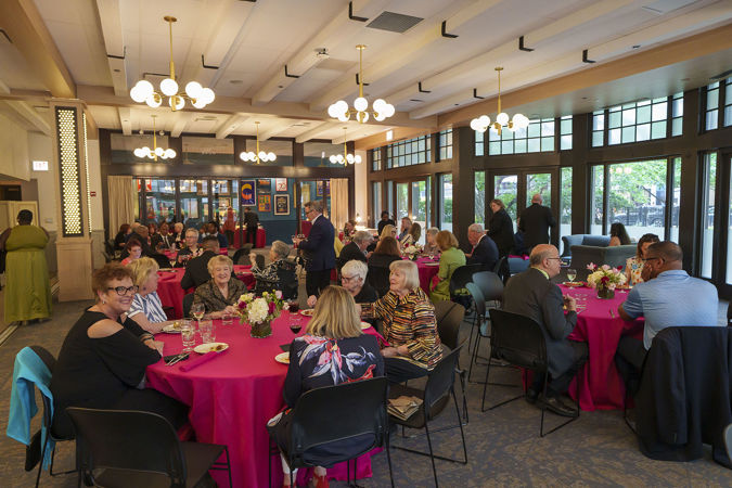 A wide shot of the Drinks/Bites benefit event