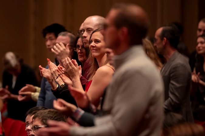 audience members clapping