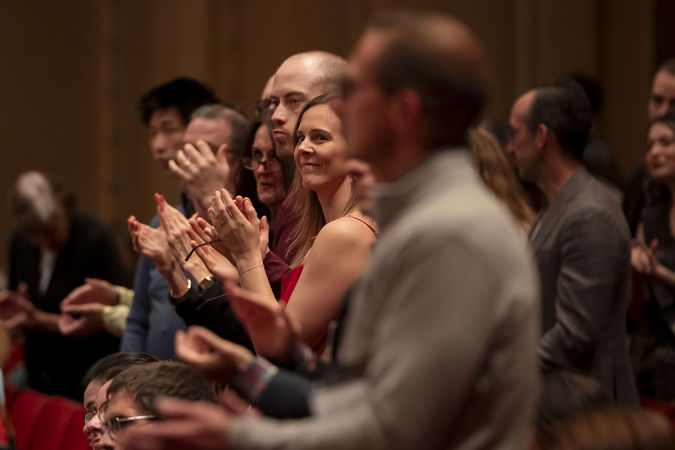 audience members clapping
