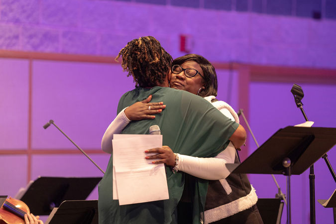 singers hugging