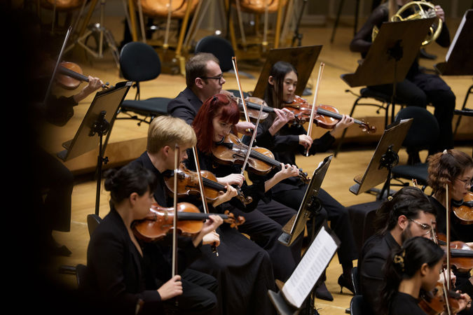 Group action shot of Civic violinists