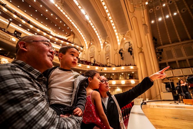 family looking at stage