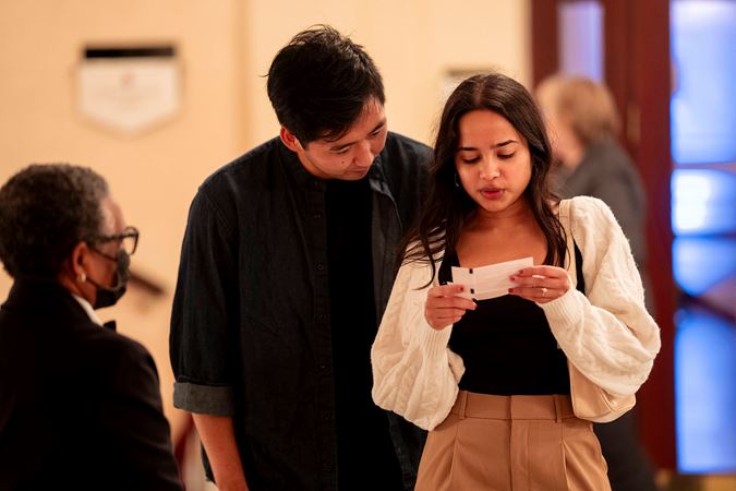 patron looking at ticket