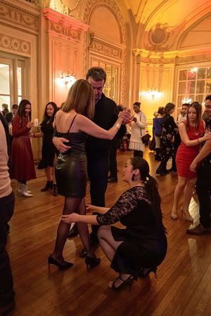 a couple is coached on how to tango at a lively preconcert class in Grainger Ballroom