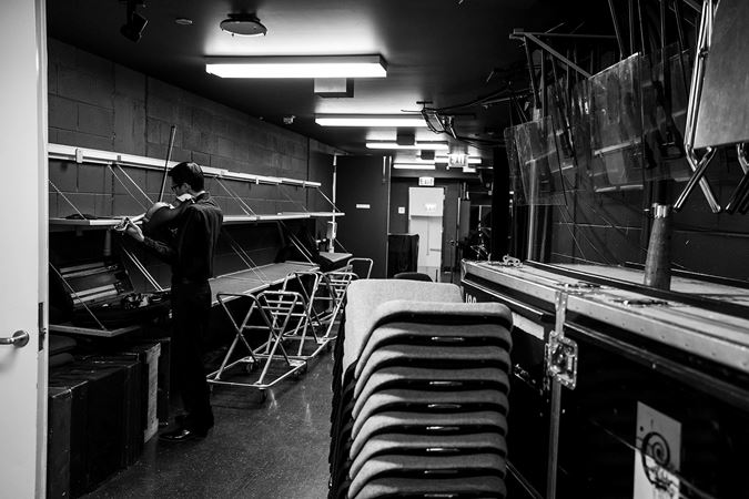 CSO viola Danny Lai warming up backstage