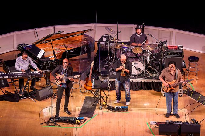 the band performs; from left, Herbie Hancock on keys, Lionel Loueke on guitar, Terence Blanchard on trumpet, Jaylen Petinaud on drums, and James Genus on bass