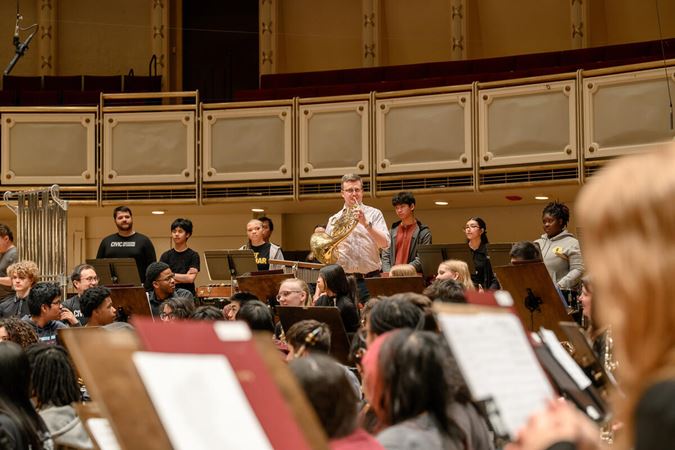 Principal Horn Mark Almond and students
