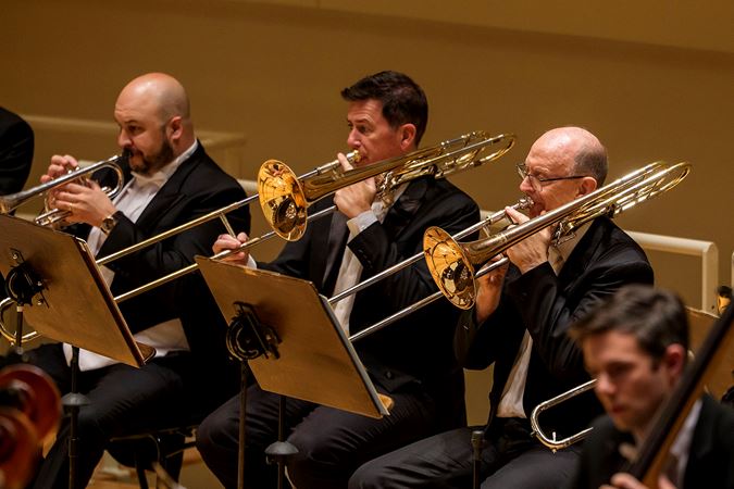 the trombone section performs
