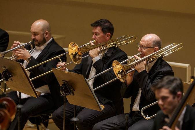 the trombone section performs