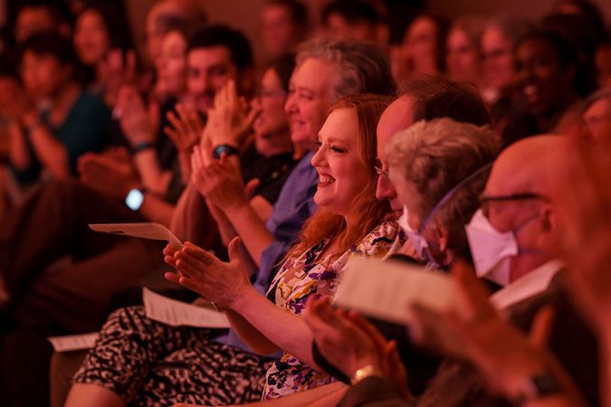 audience members clapping