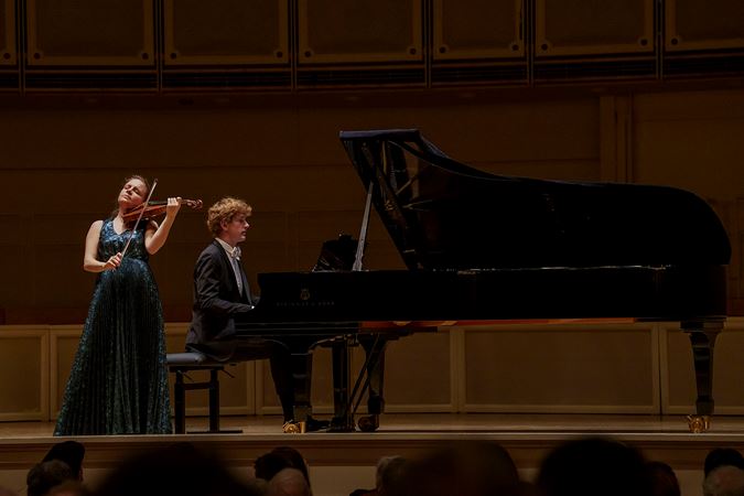Violinist Julia Fischer and pianist Jan Lisiecki performing on stage