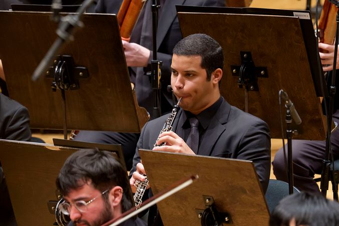 Closeup action shot of Civic Fellow and oboist Orlando Salazar