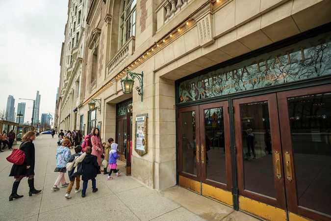 Students and their guardians walking into Orchestra Hall