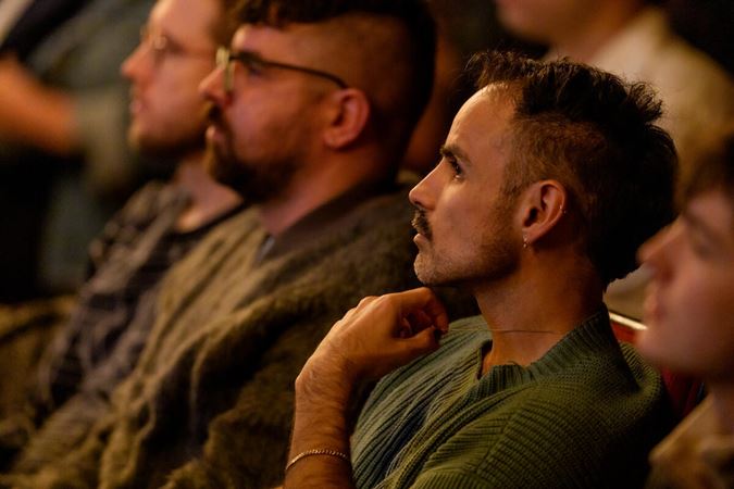 Audience member looks at the stage