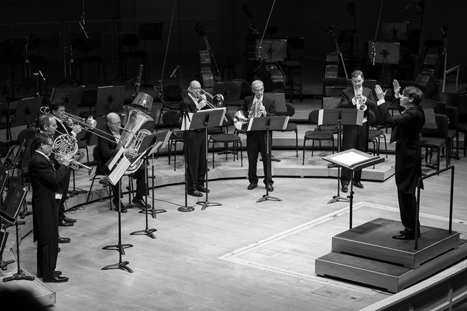 black and white: Klaus Mäkelä conducts seven members of the CSO brass section in Pierre Boulez's fanfare, Initiale
