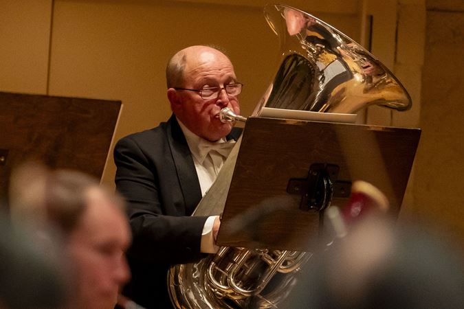 a close-up of CSO principal tuba Gene Pokorny performing