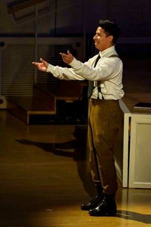 Closeup action shot of an actor (the soldier) from The Goodman presenting The Soldier's Tale