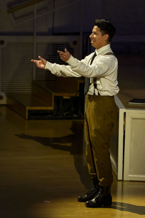 Closeup action shot of an actor (the soldier) from The Goodman presenting The Soldier's Tale