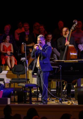 Pink Martini pianist and founder Thomas Lauderdale addresses the audience