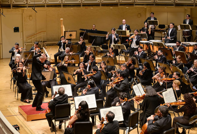 music director Carlos Miguel Prieto conducts the Sinfónica de Minería with gusto