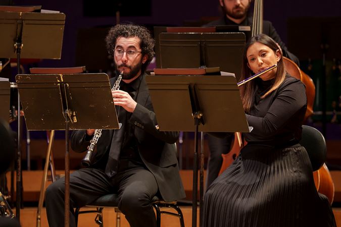 Closeup of two Civic Orchestra Fellows, a flautist and oboist