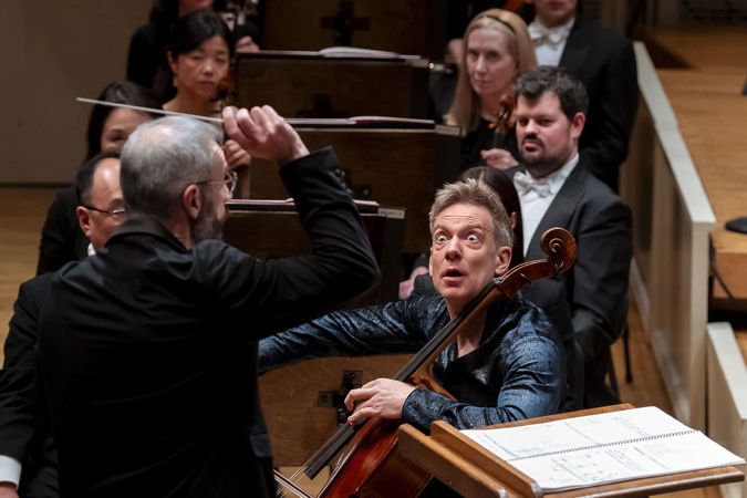 cellist Johannes Moser gives a wide-eyed stare during his performance