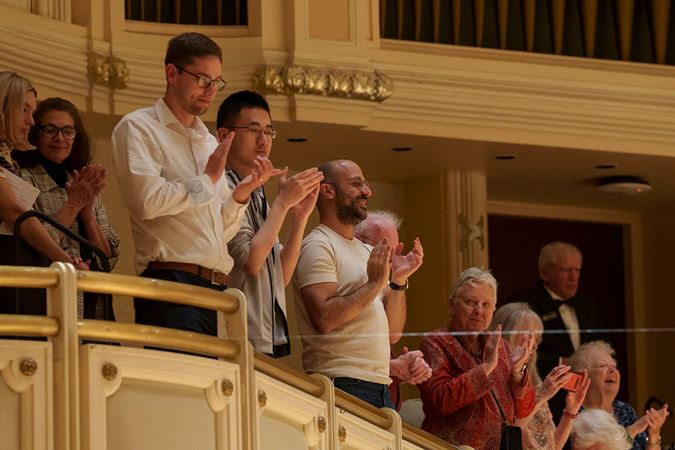 audience members clapping