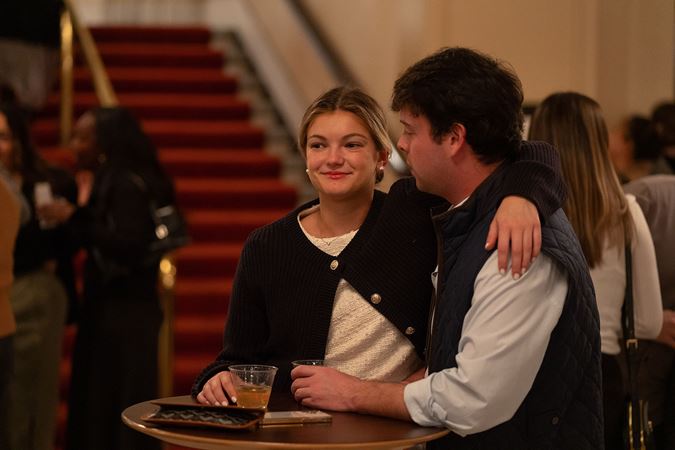 a young couple enjoys a drink before the show