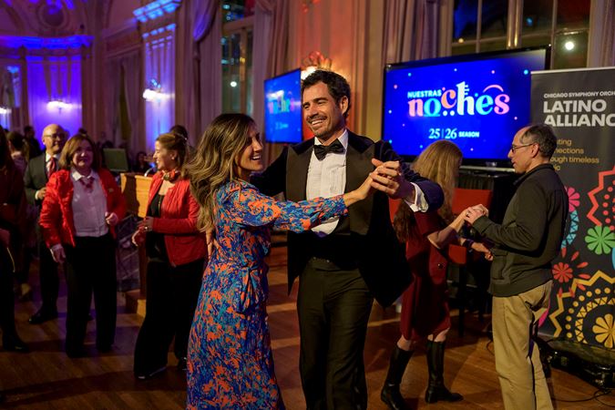 Sáinz-Villegas dances the salsa with members of the CSO Latino Alliance during their event, Noche de guitarra