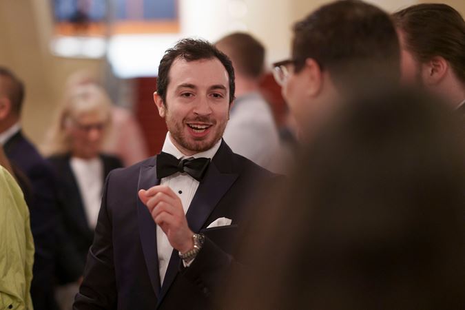 musician talking with guests