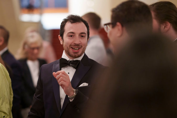 musician talking with guests
