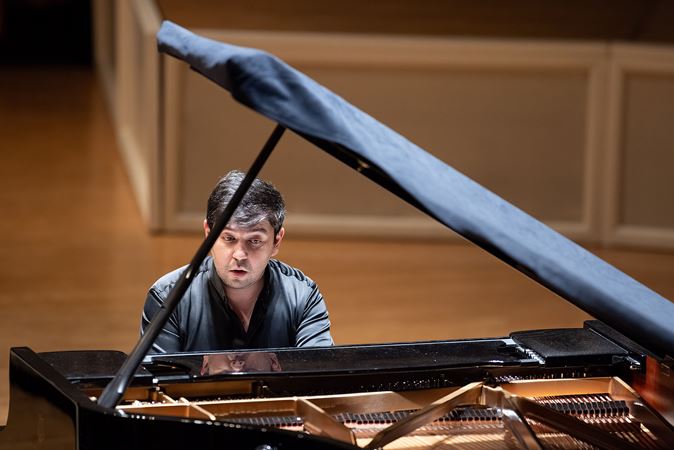 Behzod Abduraimov concentrates at the piano