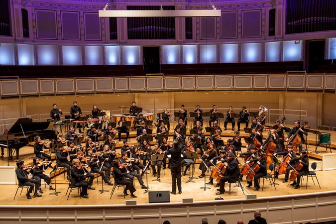 the Civic Orchestra of Chicago performs on stage
