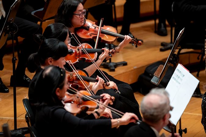 CSO violinists performing Rachmaninov's First Symphony