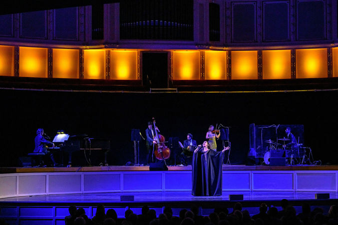 vocalist Vanina Tagini spreads her arms as she belts out a passage