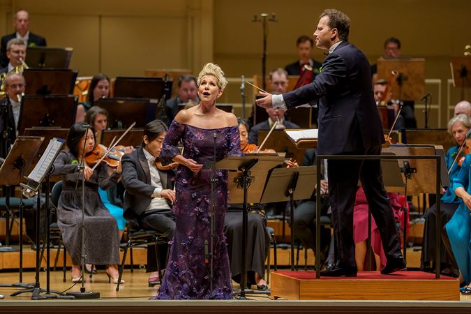 CSO Artist-in-Residence and mezzo-soprano Joyce DiDonato singing on stage while Nikolaj Szeps-Znaider leads the CSO