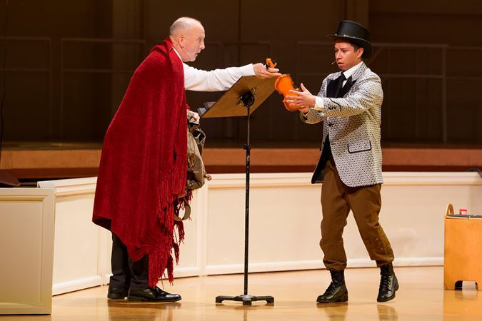 Closeup action shot of actors (the devil and the soldier) from The Goodman performing The Soldier's Tale on stage with the CSO