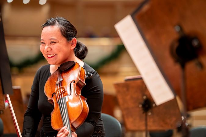 CSO principal viola Teng Li smiles before the concert
