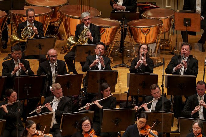 Group action shot of the CSO clarinet section with their bells up