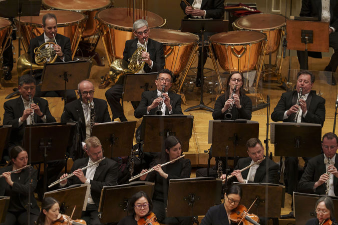 Group action shot of the CSO clarinet section with their bells up