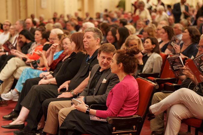 audience members chatting