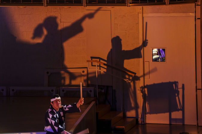 shadows dance on the wall as the drummers of Kodo move to the beat